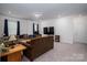 Large living room features comfortable couches, a TV, a refrigerator, and recessed ceiling lights at 250 Winford Rd, Troutman, NC 28166