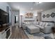Spacious living room with stylish sectional sofa, accent rug, and contemporary decor at 250 Winford Rd, Troutman, NC 28166