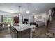 Bright and airy living space with open floor plan connecting the kitchen, dining, and living areas at 250 Winford Rd, Troutman, NC 28166