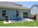 Back patio area with a seating set, grill and black outdoor storage box at 250 Winford Rd, Troutman, NC 28166