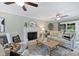 Comfortable living room featuring a fireplace, neutral decor, ceiling fan, and a sliding glass door at 2525 Saddlehorse Ln, Gastonia, NC 28056