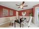 Comfortable office space with half-wall paneling, neutral carpet, ceiling fan, and ample natural light at 2525 Saddlehorse Ln, Gastonia, NC 28056