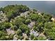 A lovely waterfront house is nestled among trees with its own dock and easy access to the open water at 26 New River Trce, Lake Wylie, SC 29710