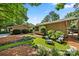 Beautiful backyard featuring a lawn, seating, and manicured landscaping at 26 New River Trce, Lake Wylie, SC 29710