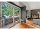 Bright bedroom with hardwood floors, and a sliding glass door to an outdoor patio, plus dark accent wall at 26 New River Trce, Lake Wylie, SC 29710