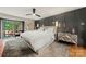 Spacious main bedroom featuring a decorative wall, plush carpet, and access to an outdoor deck at 26 New River Trce, Lake Wylie, SC 29710