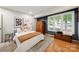 Cozy bedroom with hardwood floors, shuttered windows, and stylish decor at 26 New River Trce, Lake Wylie, SC 29710