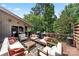 Inviting outdoor deck with comfortable seating arrangements and wooded surroundings at 26 New River Trce, Lake Wylie, SC 29710