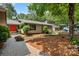 Charming home with a manicured front yard, stone walkway, and beautiful landscaping, creating curb appeal at 26 New River Trce, Lake Wylie, SC 29710