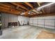 Spacious garage interior with storage cabinets and visible ceiling beams, ready for vehicles at 26 New River Trce, Lake Wylie, SC 29710