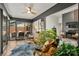 Bright living room with hardwood floors, rattan furniture, and glass doors leading to outdoor space at 26 New River Trce, Lake Wylie, SC 29710