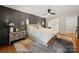 Comfortable main bedroom with accent wall, modern lighting, and plush carpet, offering a serene retreat at 26 New River Trce, Lake Wylie, SC 29710