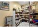 Well-stocked pantry with ample shelving for storage, featuring white tile flooring and a convenient storage system at 26 New River Trce, Lake Wylie, SC 29710