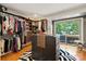 Large walk-in closet with custom storage solutions, a center island, and access to a private outdoor deck at 26 New River Trce, Lake Wylie, SC 29710