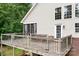 Spacious back deck overlooking the yard with screened porch and siding on home at 2695 Queens Rd, Lincolnton, NC 28092