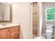 Bathroom with a light wood vanity, and a tile shower with built in bench at 2695 Queens Rd, Lincolnton, NC 28092