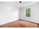 Bedroom with hardwood floors and a window providing natural light at 2695 Queens Rd, Lincolnton, NC 28092
