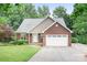 Charming brick home featuring an attached two-car garage and well-manicured lawn at 2695 Queens Rd, Lincolnton, NC 28092