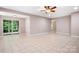Spacious living room with tile flooring, sliding glass door and neutral paint at 2695 Queens Rd, Lincolnton, NC 28092