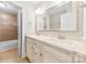 Bathroom with double vanity, large mirror, and shower-tub combo in separate room at 2857 Scarborough Ct, Gastonia, NC 28054