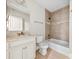 Well-lit bathroom with a white vanity, decorative mirror, and tiled shower at 2857 Scarborough Ct, Gastonia, NC 28054