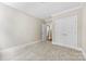 Bedroom features neutral carpet, paint, white trim and closet with bi-fold doors at 2857 Scarborough Ct, Gastonia, NC 28054