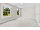 Sun-filled bedroom with plush carpet and a large window at 2857 Scarborough Ct, Gastonia, NC 28054