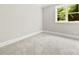 Bedroom featuring neutral carpet, paint and a sun-drenched window at 2857 Scarborough Ct, Gastonia, NC 28054