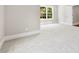 Sunlit bedroom with plush carpet and view of backyard at 2857 Scarborough Ct, Gastonia, NC 28054