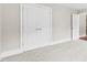 Bright bedroom featuring double doors leading to a closet and neutral carpeting at 2857 Scarborough Ct, Gastonia, NC 28054