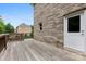Wooden deck with a brick exterior wall and a view of the yard and surrounding homes at 2857 Scarborough Ct, Gastonia, NC 28054