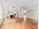 Open floorplan kitchen featuring an island, stainless appliances, and hardwood floors at 2857 Scarborough Ct, Gastonia, NC 28054