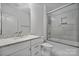 Bathroom featuring granite counters, vanity, and a glass-enclosed shower at 3008 Laney Pond Rd, Matthews, NC 28104