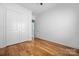 Bedroom with hardwood floors, closet, and ensuite bathroom access at 3008 Laney Pond Rd, Matthews, NC 28104