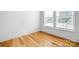 Cozy bedroom with hardwood floors and ample natural light from the window at 3008 Laney Pond Rd, Matthews, NC 28104