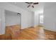 Bedroom with hardwood floors and natural light streaming through the window at 3008 Laney Pond Rd, Matthews, NC 28104
