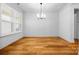 Dining room featuring hardwood floors and natural light at 3008 Laney Pond Rd, Matthews, NC 28104
