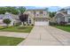 Charming two-story home featuring a spacious driveway and well-maintained landscaping at 3008 Laney Pond Rd, Matthews, NC 28104