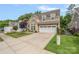 Charming two-story home featuring a spacious driveway and well-maintained landscaping at 3008 Laney Pond Rd, Matthews, NC 28104