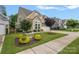 Beautiful two-story home with a well-manicured lawn and lovely landscaping at 3008 Laney Pond Rd, Matthews, NC 28104
