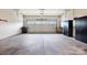 Spacious garage offers ample space for parking and storage with concrete flooring at 3008 Laney Pond Rd, Matthews, NC 28104