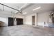 Spacious garage offers ample space for parking and storage with concrete flooring at 3008 Laney Pond Rd, Matthews, NC 28104