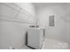 Functional laundry room featuring shelving and modern washer and dryer at 3008 Laney Pond Rd, Matthews, NC 28104