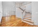 Hardwood floors and bright, open floor plan featuring view to exterior patio and wood staircase at 3008 Laney Pond Rd, Matthews, NC 28104
