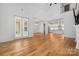 Spacious open-concept living area with hardwood floors and seamless flow into kitchen and dining at 3008 Laney Pond Rd, Matthews, NC 28104