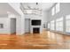 Spacious living area featuring a fireplace, hardwood floors, and a soaring two-story ceiling at 3008 Laney Pond Rd, Matthews, NC 28104