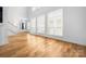 Spacious living room with hardwood floors, lots of natural light, and an open layout at 3008 Laney Pond Rd, Matthews, NC 28104