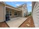 Covered patio features concrete, ceiling fan, neutral paint and access to the backyard at 3008 Laney Pond Rd, Matthews, NC 28104