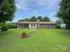 Grassy backyard featuring an expansive yard and classic home exterior at 302 Melinda Ave, Kannapolis, NC 28083