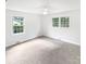 An empty bedroom with lots of natural light and wall-to-wall carpeting at 302 Melinda Ave, Kannapolis, NC 28083